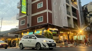 A multi-story building with a restaurant on the ground floor. - SK Residence And Restaurant Patong  (Patong)