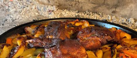 A roasted dish with meat and vegetables in a pan.