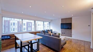 Departamento, vista a la ciudad | Área de sala de estar