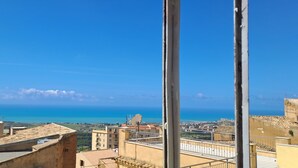 A coastal cityscape with buildings and a clear blue sky. - Casuzza at the Dome with a Sea View, within walking distance of the Cathedral! (Agrigento)