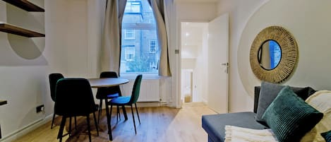 Apartment, City View | Living area | Flat-screen TV