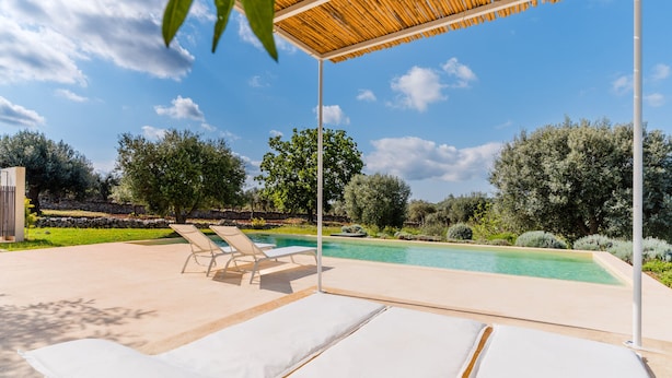 A pool area with lounge chairs and a pergola. - Ker Rail Villa With Pool by Wonderful Italy (Ostuni)