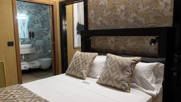 Luxury Studio Suite, City View | Premium bedding, minibar, in-room safe, laptop workspace