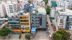 A multi-story hotel with a prominent sign for 'White Ridge Premium Hotel'. - Whiteridge Premium (Hyderabad)