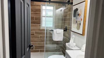Shower, hair dryer, towels, soap