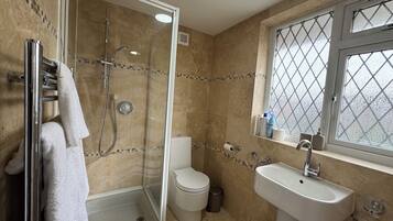 Shower, hair dryer, towels, soap