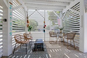 Outdoor dining - Renovated Getaway for 2 ~ Hot Tub and Fire Pit! (Kill Devil Hills)