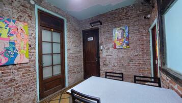 Full-size fridge, griddle, cleaning supplies, freezer