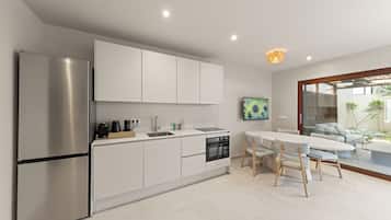 Family Bungalow, 2 Bedrooms, Lanai, Garden View | Private kitchen | Fridge, microwave, oven, stovetop