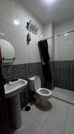 A bathroom with a toilet, sink, and shower. - cozy apartment tanger N2 (Tangier-Tétouan-Al Hoceima)