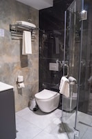 Shower, free toiletries, hair dryer, slippers