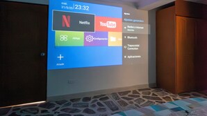 A projection of a smart TV displaying a user interface with options like Netflix and YouTube. - Spacious 3BR in Central Medellín • Home Theater • Near Laureles & Poblado
 (Medellín)