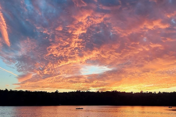 View of clear lake at sunset.