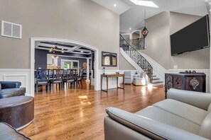 Smart TV, fireplace, books, printers