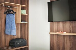 Enjoy a functional room with a flat-screen TV, wardrobe, and ample storage for your belongings.