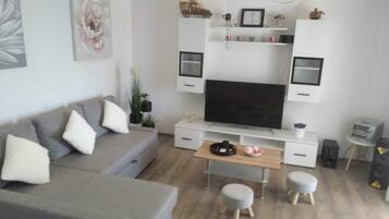 House (Holiday Home Luca) | Living room | 32-inch flat-screen TV with cable channels