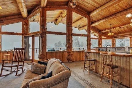 Living area. 6810 Orchid Dr, Salcha, AK - Log Cabin with Mountain Views, Sauna Included