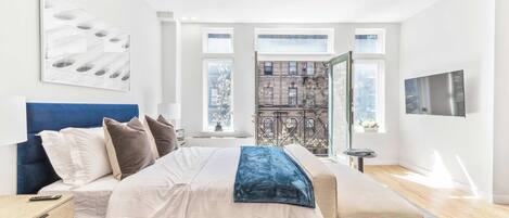 1 bedroom, desk, iron/ironing board, travel crib