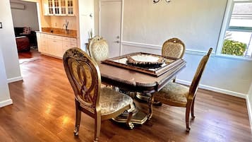 Enjoy meals in this elegant dining area with a classic table and comfortable chairs.