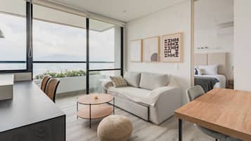 Apartment, City View | Living area | 55-inch Smart TV with cable channels, fireplace, heated floors