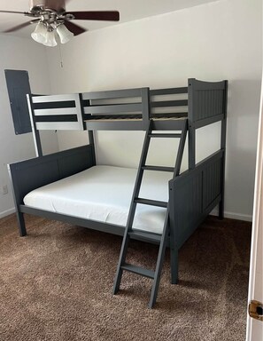Cozy retreat with a bunk bed and ladder, perfect for a comfortable stay.