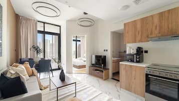 Apartamento econômico | Área de estar | Smart TV 50 polegadas com canais digitais