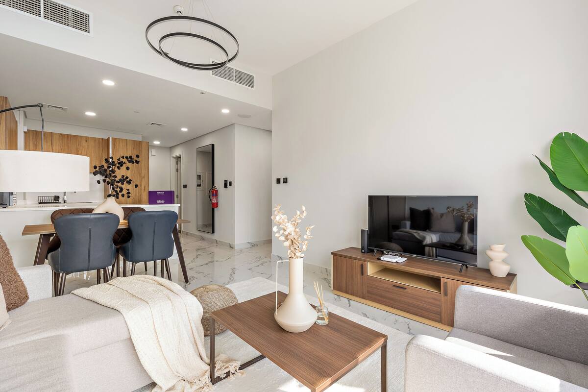 Grand Apartment | Living area | 50-inch Smart TV with digital channels