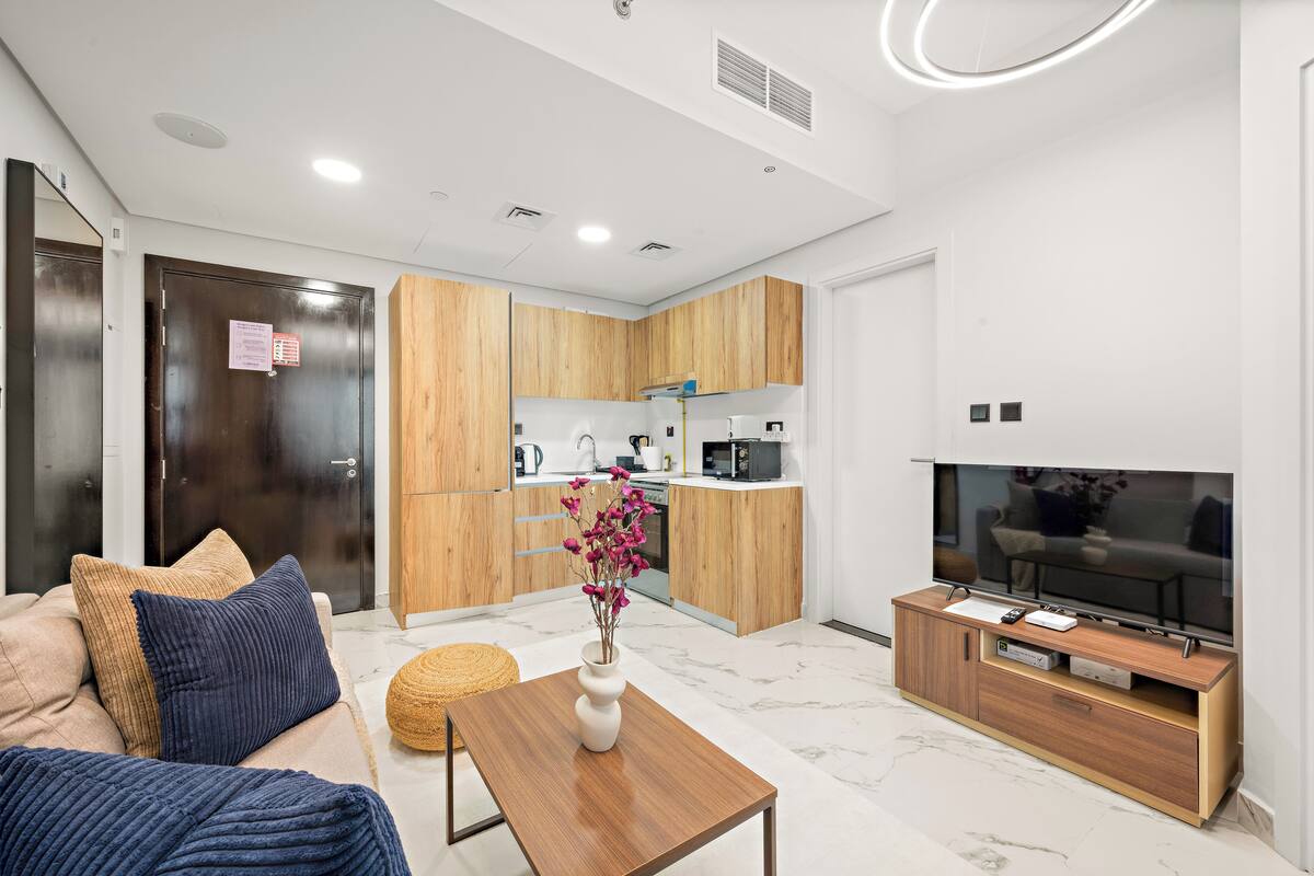 Comfort Apartment | Living area | 50-inch Smart TV with digital channels