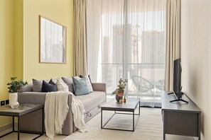 Appartement Exclusif | Coin séjour | TV connectée