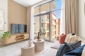 Appartement Deluxe | Coin séjour | TV connectée de 50 pouces avec chaînes numériques