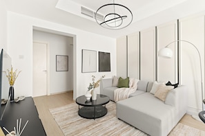 Appartement Deluxe | Coin séjour | TV connectée de 50 pouces avec chaînes numériques