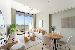 Appartement Exclusif | Coin séjour | TV connectée de 50 pouces avec chaînes numériques