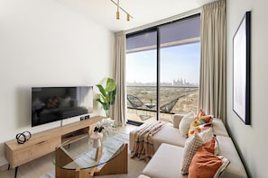 Appartement Exclusif | Coin séjour | TV connectée de 50 pouces avec chaînes numériques