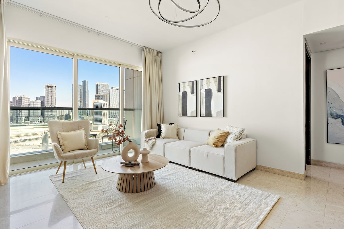 Deluxe Apartment | Living area | 50-inch Smart TV with digital channels