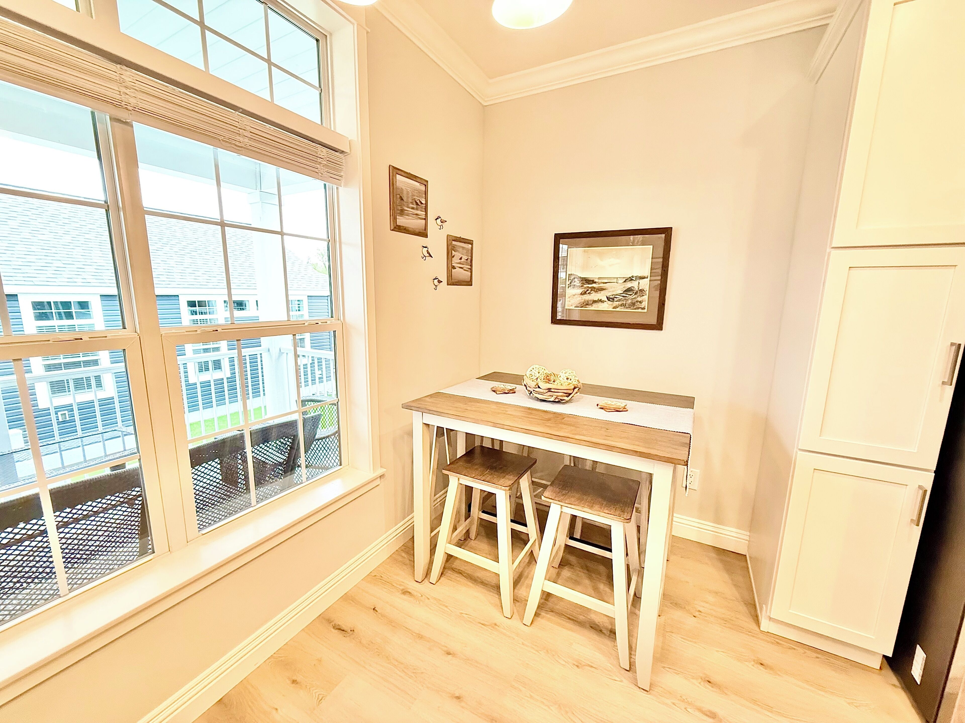 Breakfast Nook with a View
Enjoy quiet mornings or intimate meals in this charming nook, surrounded by natural light and views of the community outside.