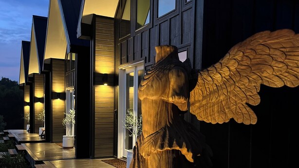 A modern building with a unique winged statue in front. - IF Stay Collection is an exquisite and unexpected stand alone Row House. (Carriere)