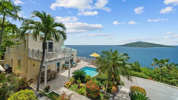 A resort with a pool, outdoor seating, and a view of the sea. - Generator! 2 Primary Bedrooms - Magens Bay - Dining (St. Thomas)