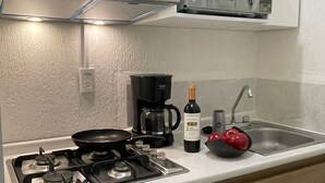 Apartamento conforto, vista para o jardim | Cozinha privada