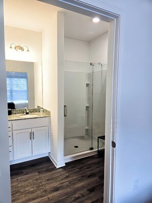 Shower, hair dryer, towels, toilet paper