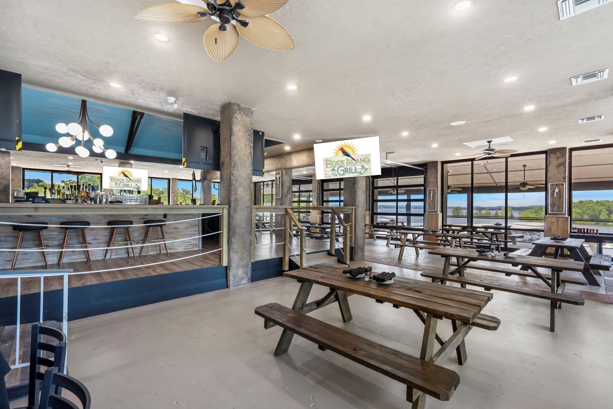 Casual dining with a lakeview backdrop! Gather at Rock Island Grill's spacious indoor picnic-style tables, perfect for sharing meals, laughs, and stunning views of Table Rock Lake.