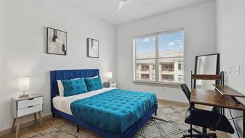 1 bedroom, desk, iron/ironing board, travel crib