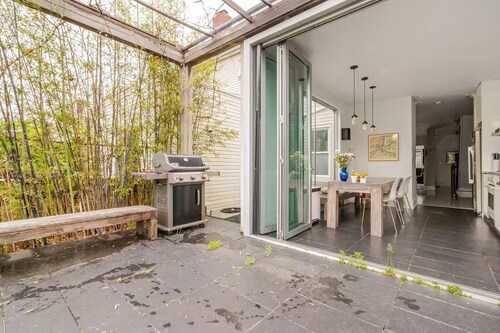 Spacious, artful 4-bedroom house in Brooklyn with lush backyard, parking, A/C