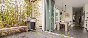 Spacious, artful 4-bedroom house in Brooklyn with lush backyard, parking, A/C