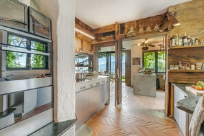 Fridge, stovetop, dishwasher, coffee/tea maker