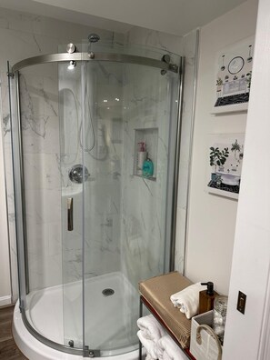 Shower, hair dryer, towels, soap