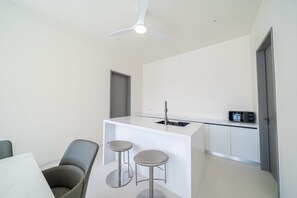 Fridge, microwave, stovetop, dining tables