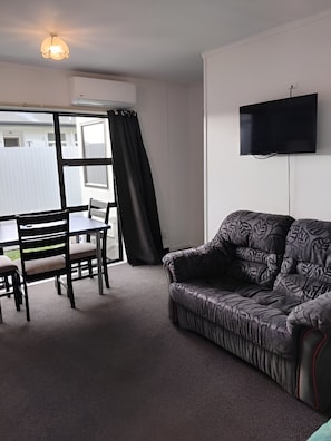 Family Suite, Patio | Living area