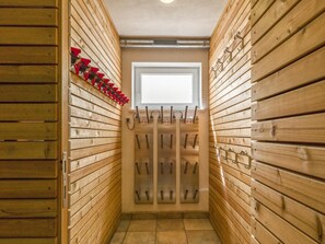 Leading to a door with a window above, this hallway offers a glimpse into the space beyond.