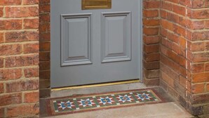 A grey double door with a brass knocker and a small brass mail slot. - Spacious House, Private Parking & Garden (Gloucestershire)
