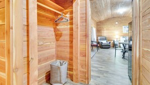 A wooden interior with a hallway leading to a dining area. - Half-Mi to Bull Shoals Lake Access: Angler's Cabin (Lakeview)